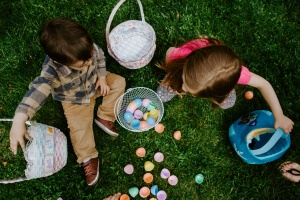 Picture of children counting Easter eggs on a lawn